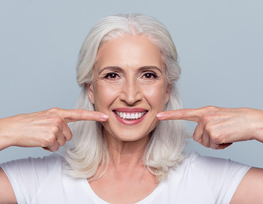 Smiling woman with dental implants