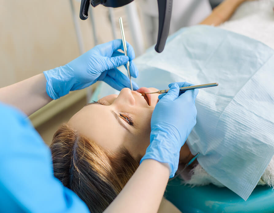 dentist examining a patient's mouth