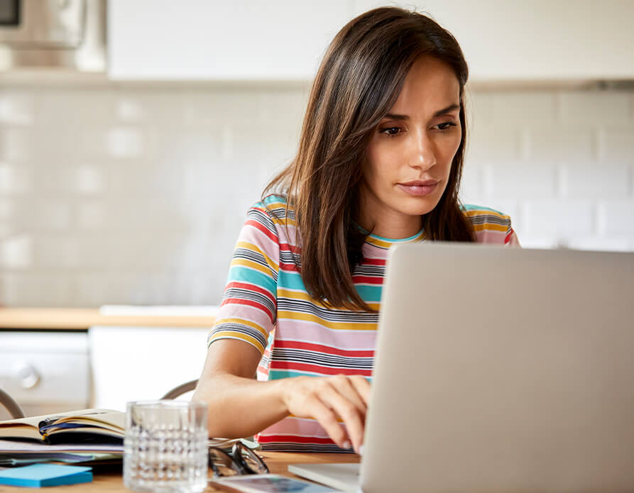 woman looking at her laptop