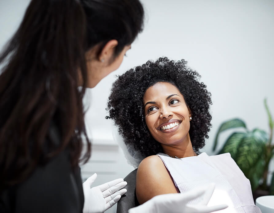 smiling woman sitting in a dental chair