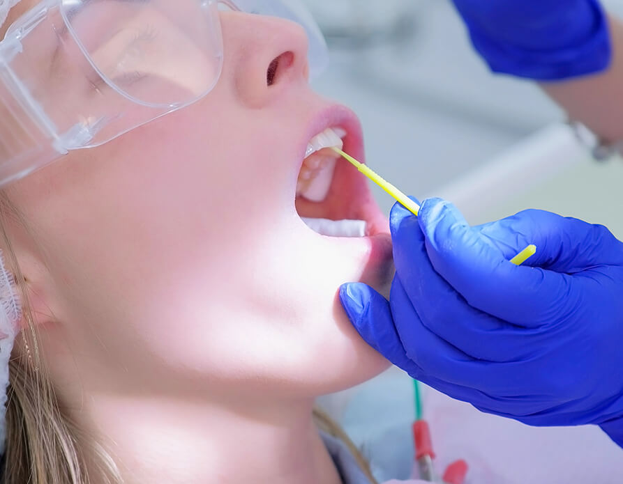 dental patient receiving fluoride treatment