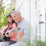 smiling grandpa with granddaughter who used dental tips for seniors