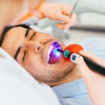 adult man getting dental sealants