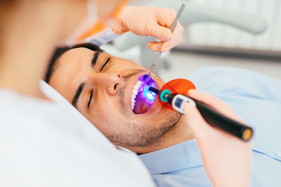 adult man getting dental sealants