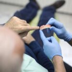 food stuck under denture